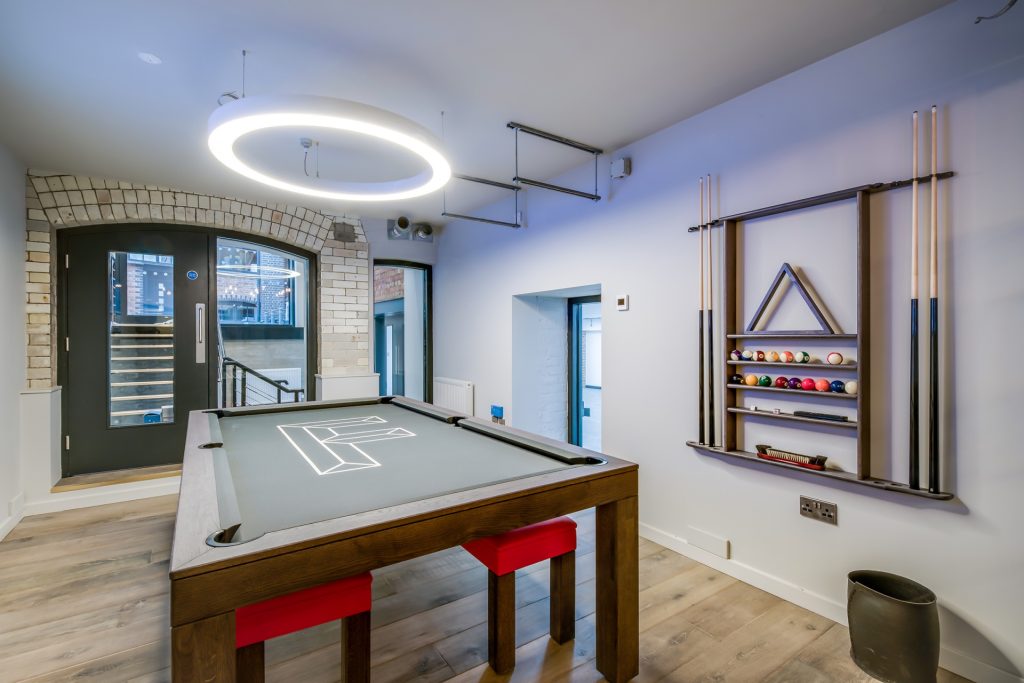 Contemporary Pool Dining Table with branded 'F' Logo